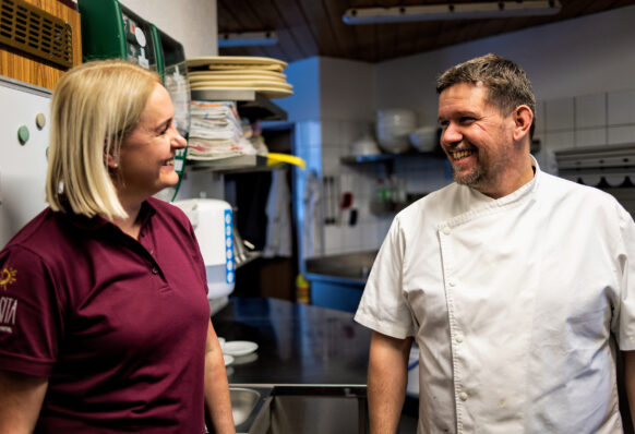 Silvia and Peter at work in the kitchen.